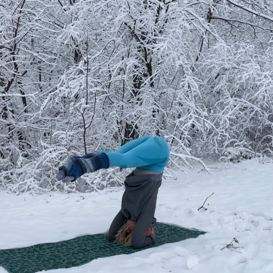 Headstand outdoors in the snow