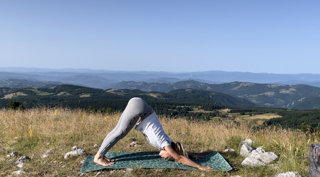Downward dog on a mountain